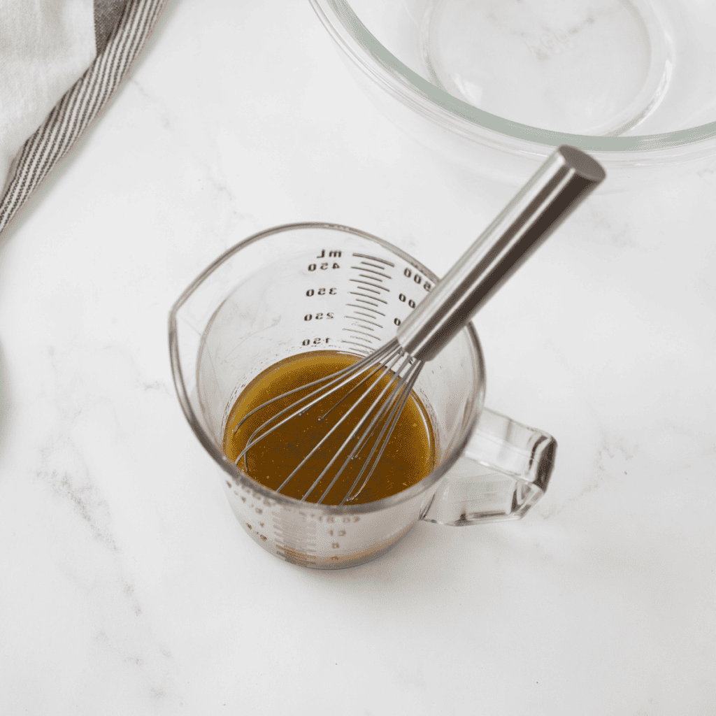 Melted butter, Worcestershire sauce, garlic powder, and seasonings stirred in a small bowl