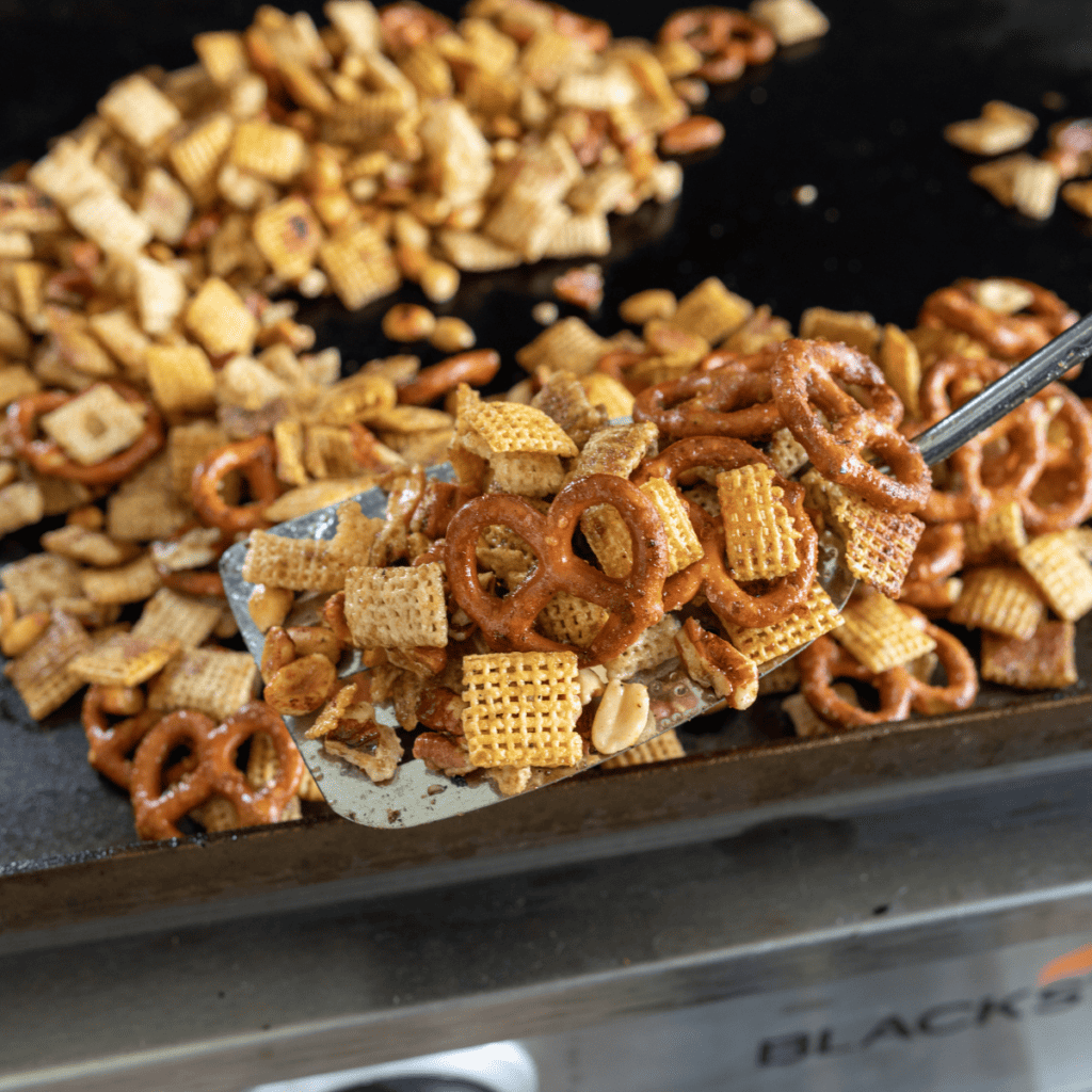 Toasted Chex mix removed from the griddle and cooling before storage