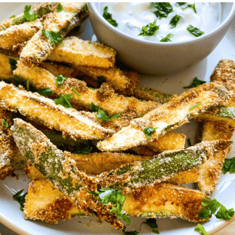 Golden brown and crispy Copycat Carrabba’s Zucchini sticks served on a plate, perfect for an appetizer or side dish.