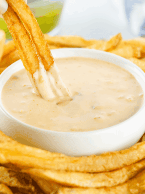 Small bowl of creamy Copycat Freddy’s Fry Sauce with a side of golden fries