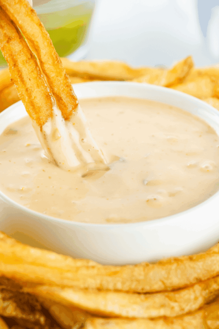 Small bowl of creamy Copycat Freddy’s Fry Sauce with golden crispy fries on the side