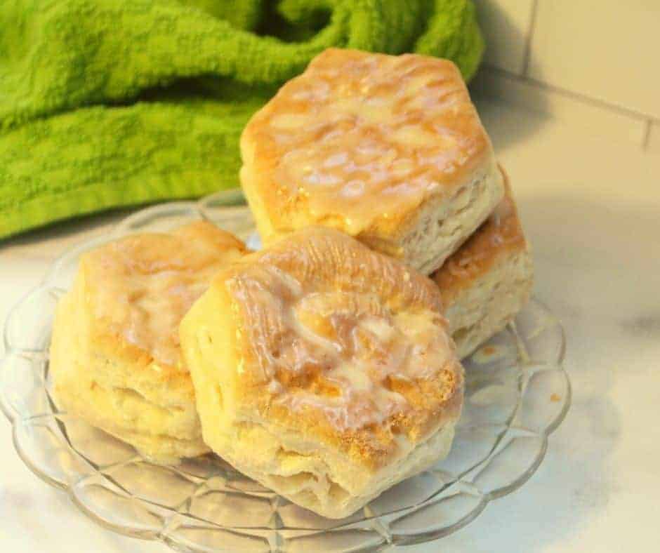 cooked frozen biscuits in air fryer on a glass plate