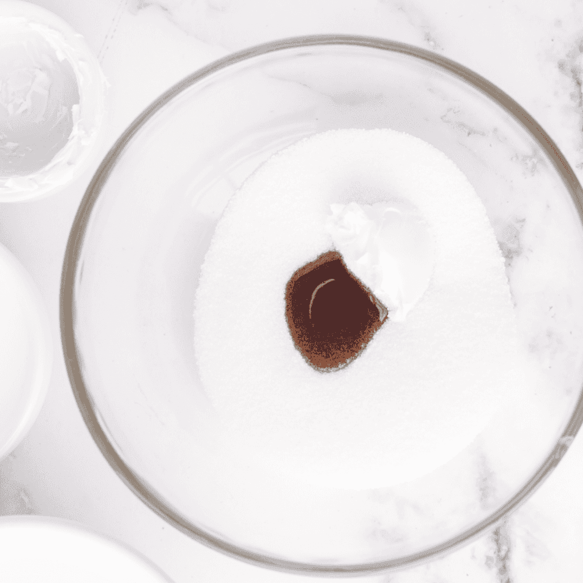 Homemade vanilla ice cream base poured into a Ninja Creami pint before the 24-hour freeze