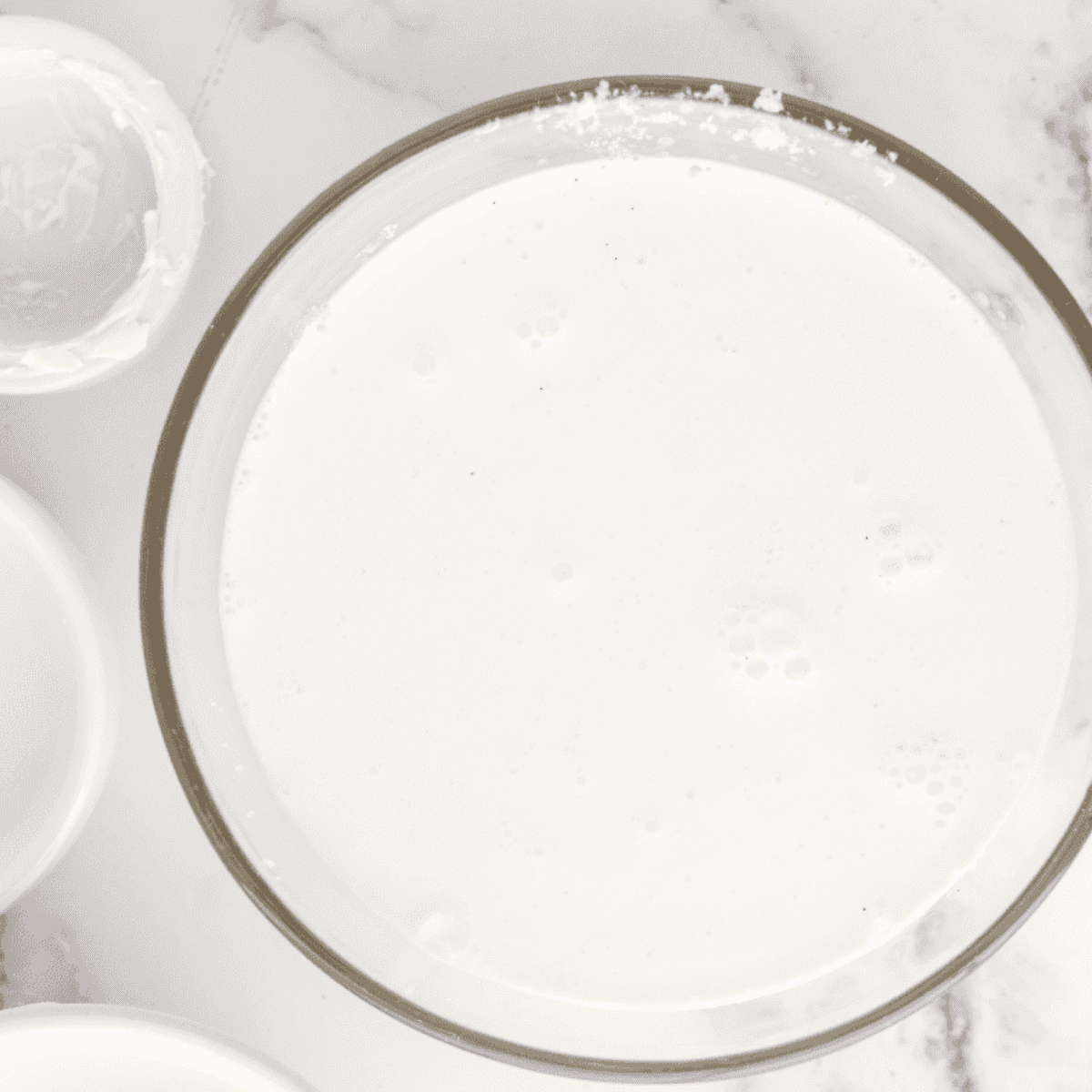 Smooth, freshly spun vanilla bean ice cream in a Ninja Creami pint after the ice cream cycle