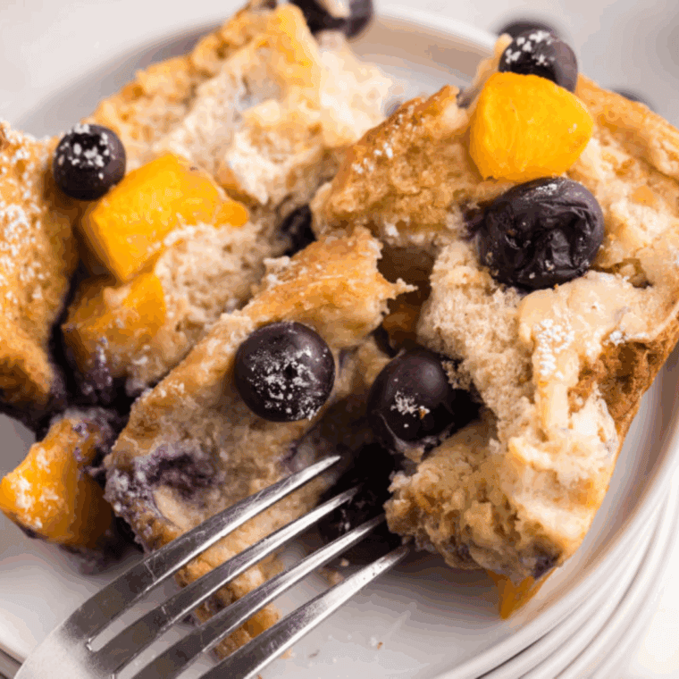 Golden air fryer French toast casserole in a white dish, ready to serve
