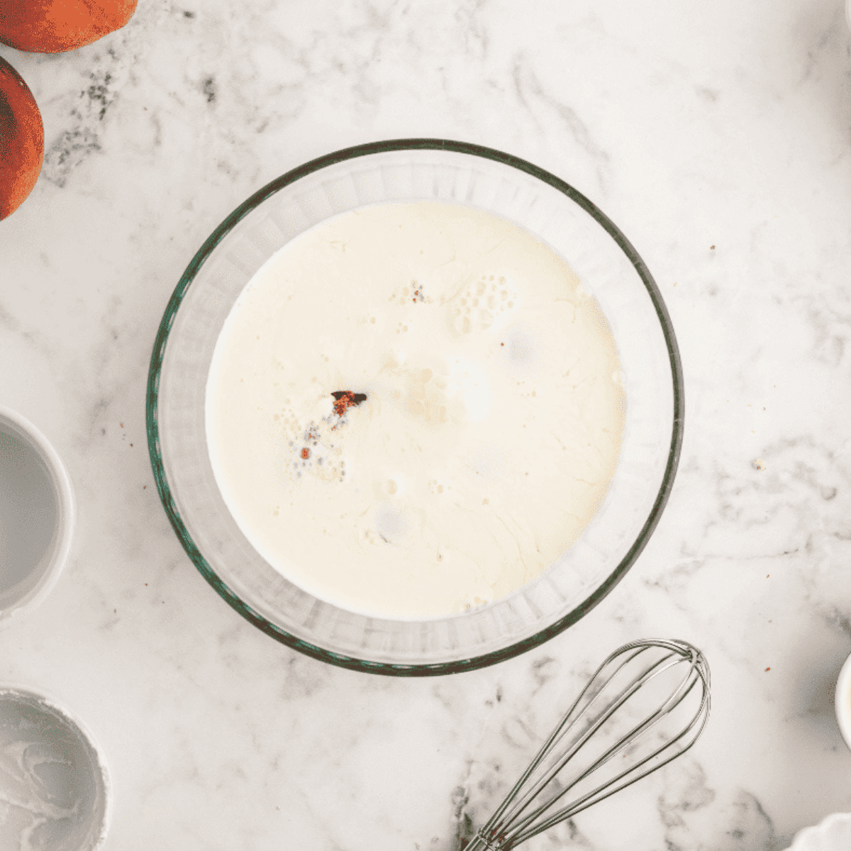 Cinnamon-vanilla custard whisked in a bowl for French toast casserole
