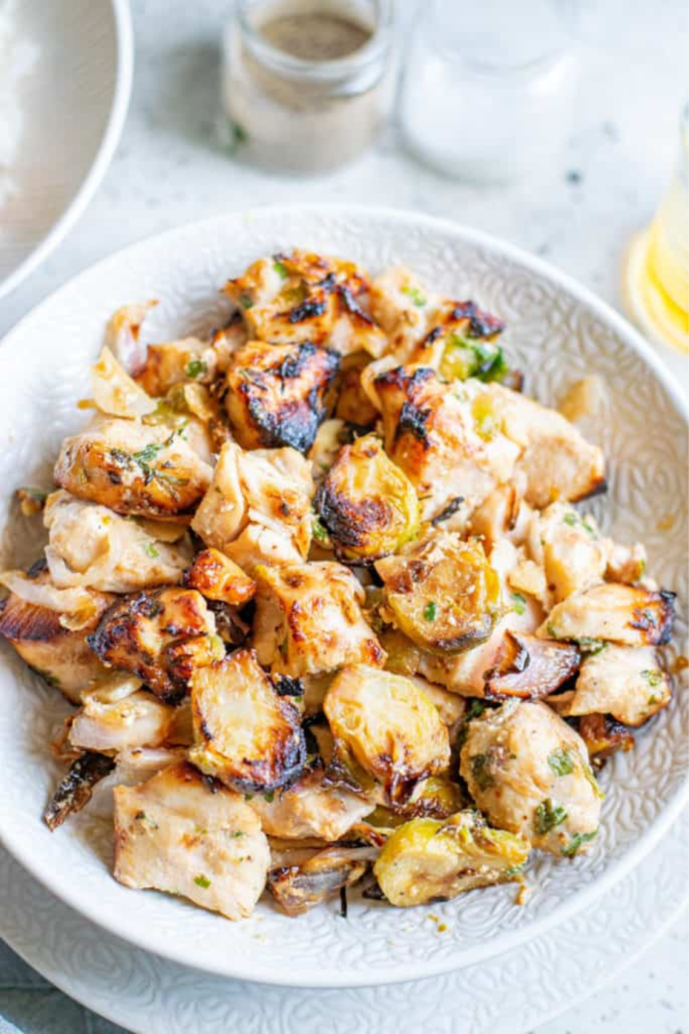 air fryer chicken and brussels sprouts cooked together in one basket for a quick and healthy weeknight meal