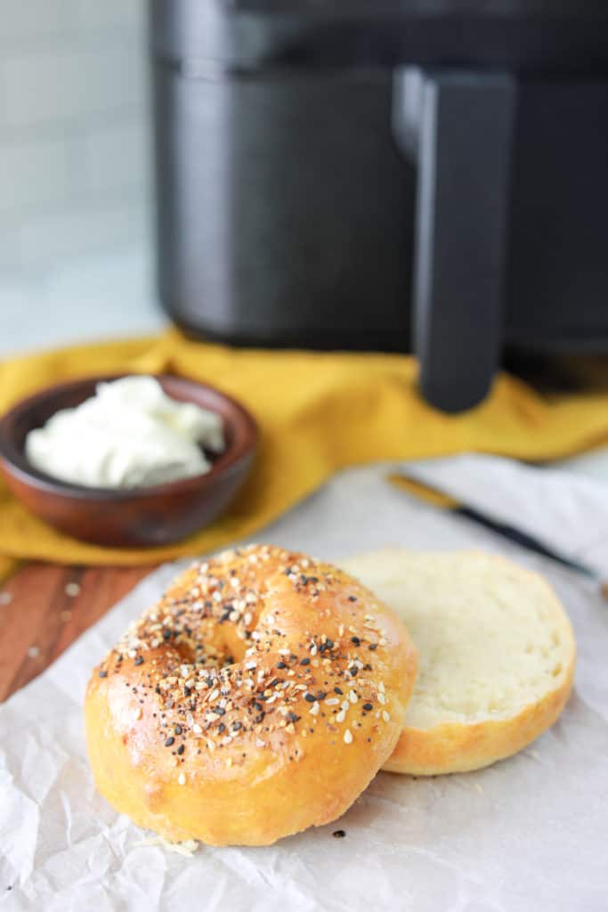 Close-up of air fryer gluten-free bagels with a beautifully baked surface and airy crumb