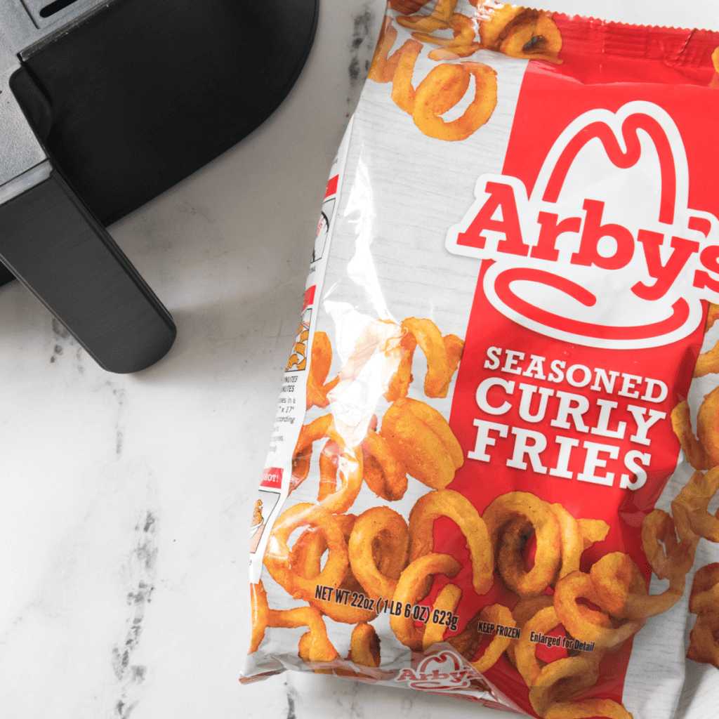 Ingredients needed for Arby's Curly Fries In Air Fryer on kitchen table.