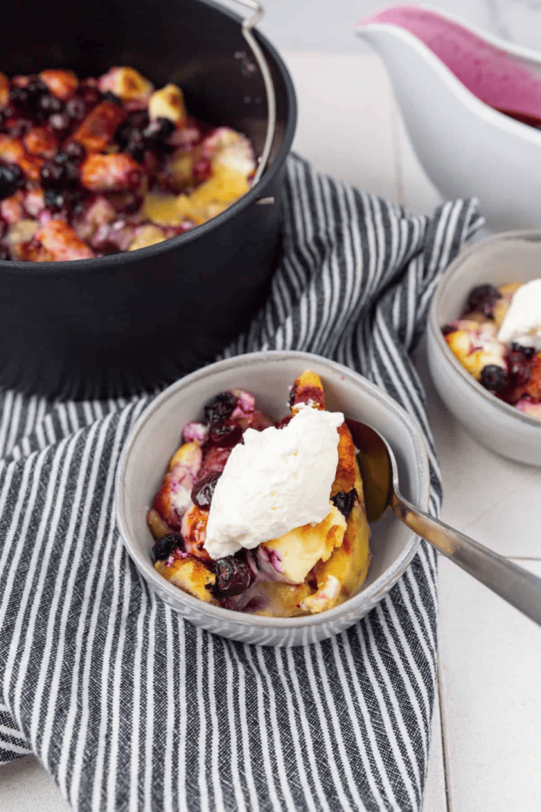 Air fryer blueberry French toast casserole with golden baked bread and fresh blueberries on top
