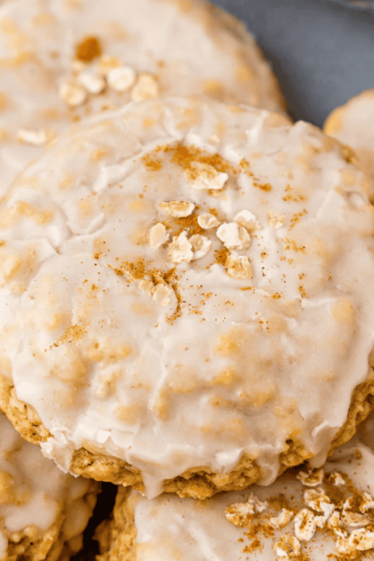 Plate of Air Fryer Copycat Crumbl Iced Oatmeal Cookies with soft, chewy centers and sweet frosting drizzle