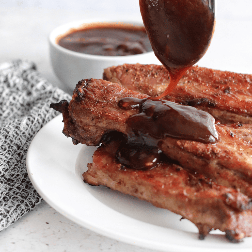 Plate of Air Fryer Fireball Glazed Ribs with a golden, caramelized glaze.