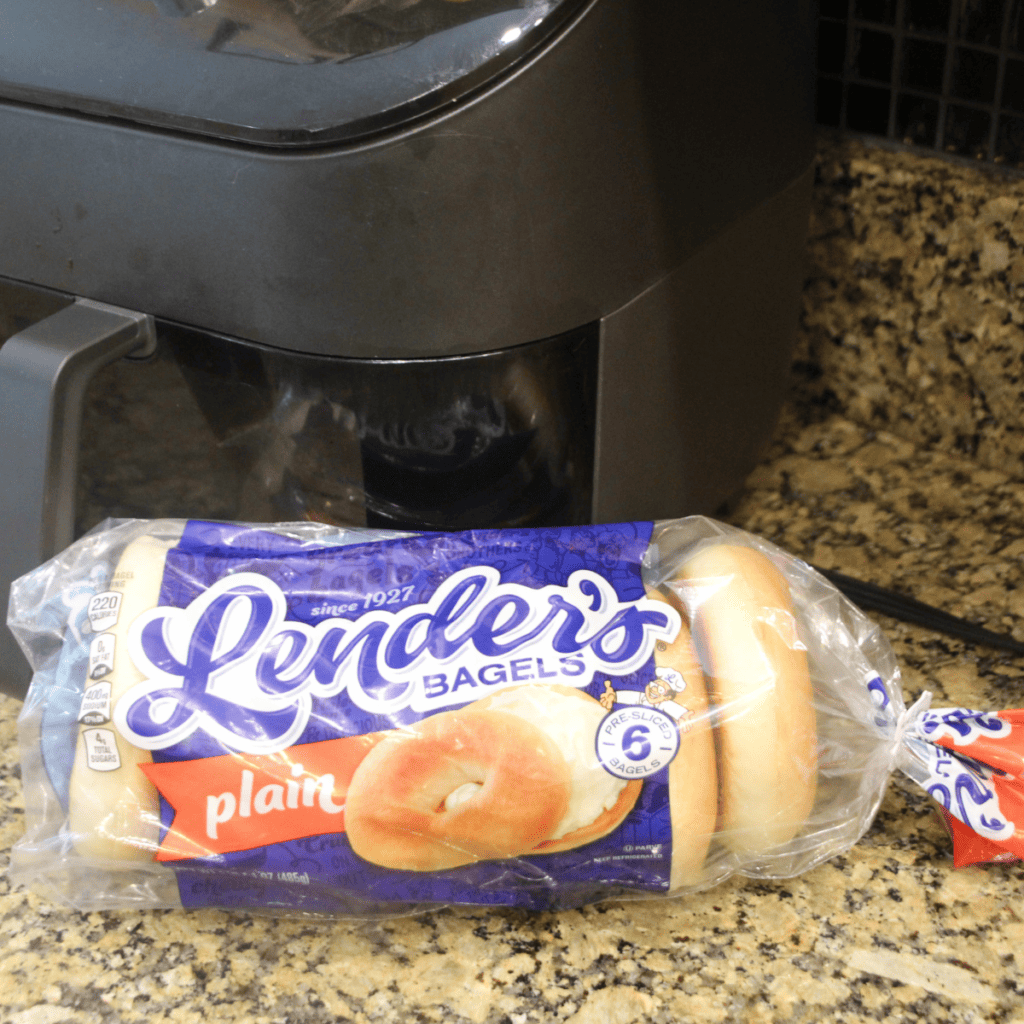 Close up of picture of package of Lender’s bagels on countertop with an air fryer in the background.