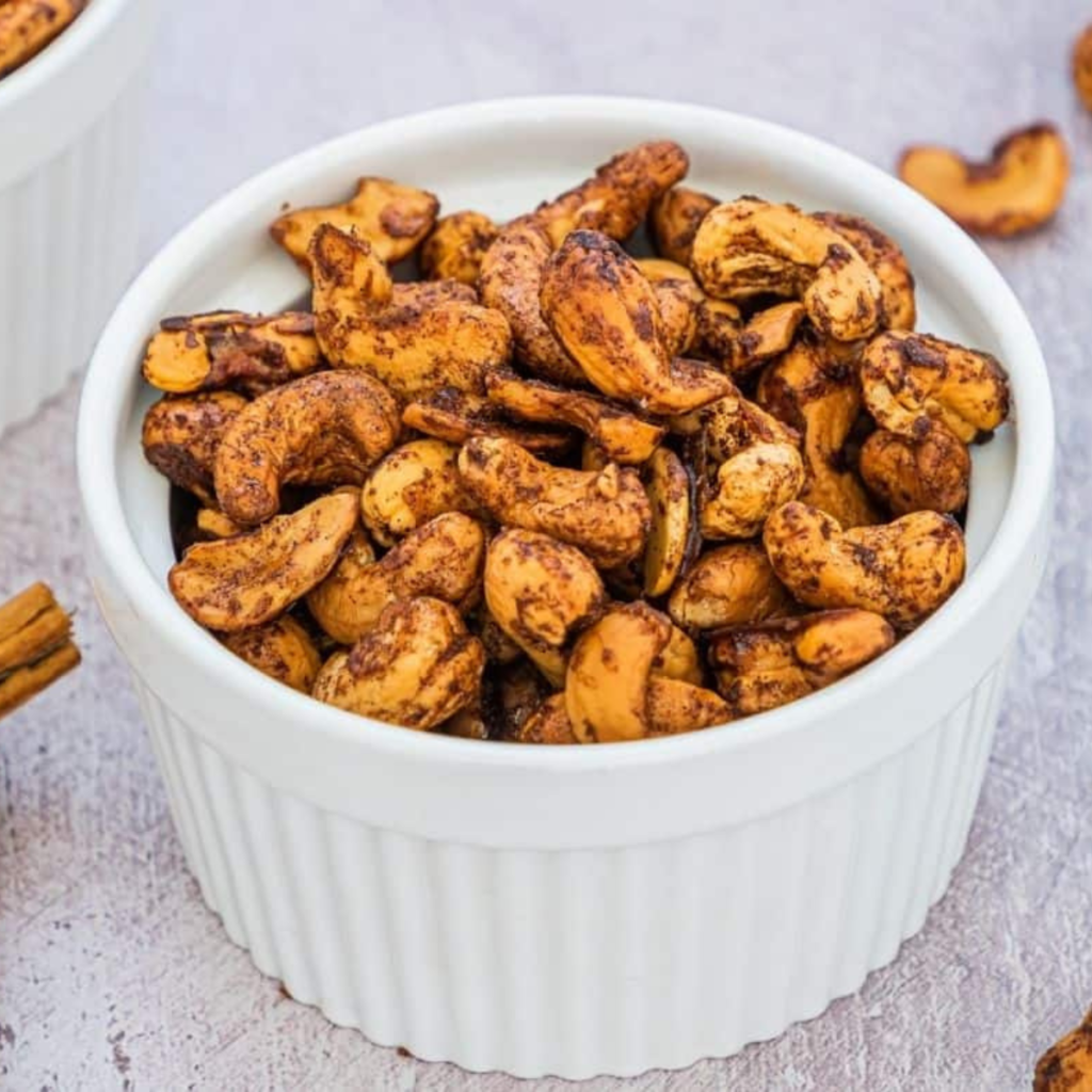 Bowl of Air Fryer Maple Cinnamon Cashews, showcasing their crunchy texture and sweet glaze.
