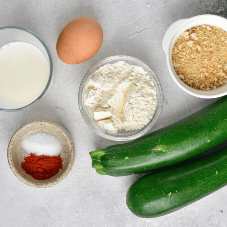 Ingredients needed for Easy Air Fryer Cool Ranch Zucchini Chips on kitchen table.