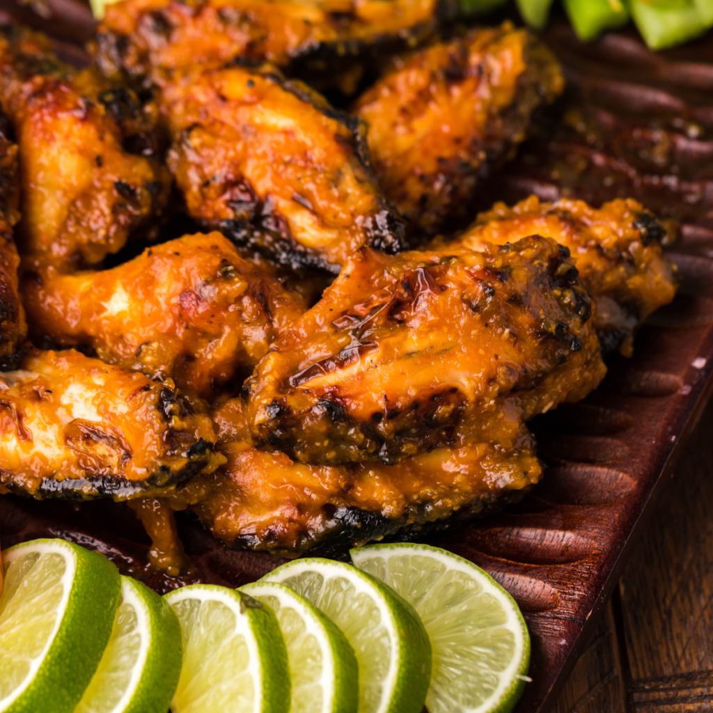 "Appetizing serving of Air Fryer Spicy Apricot Glazed Chicken Wings, illustrating their crispy texture and juicy meat, ideal for an easy appetizer or main dish."