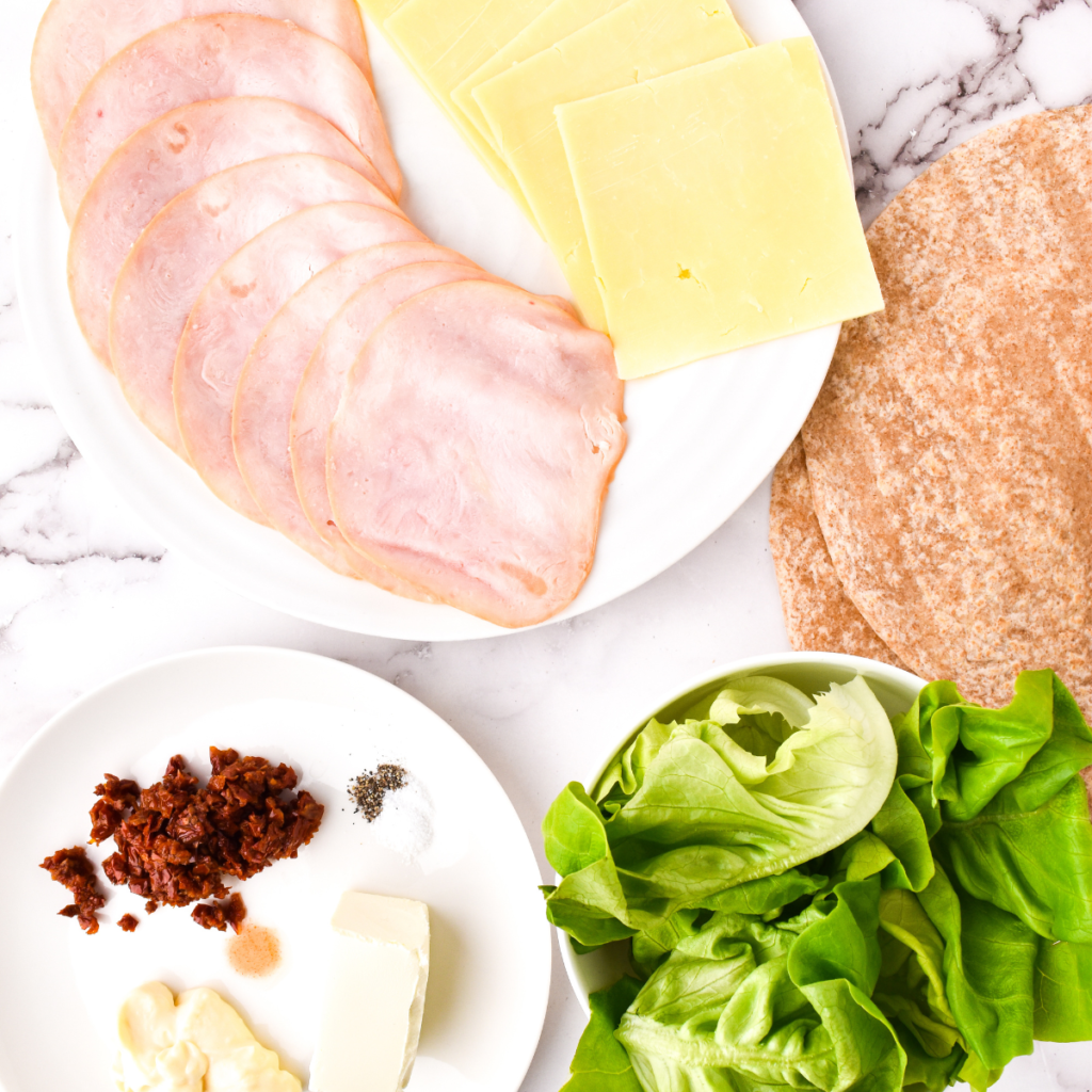 Ingredients Needed For Air Fryer Turkey and Cheese Pinwheel Sandwiches on kitchen table.
