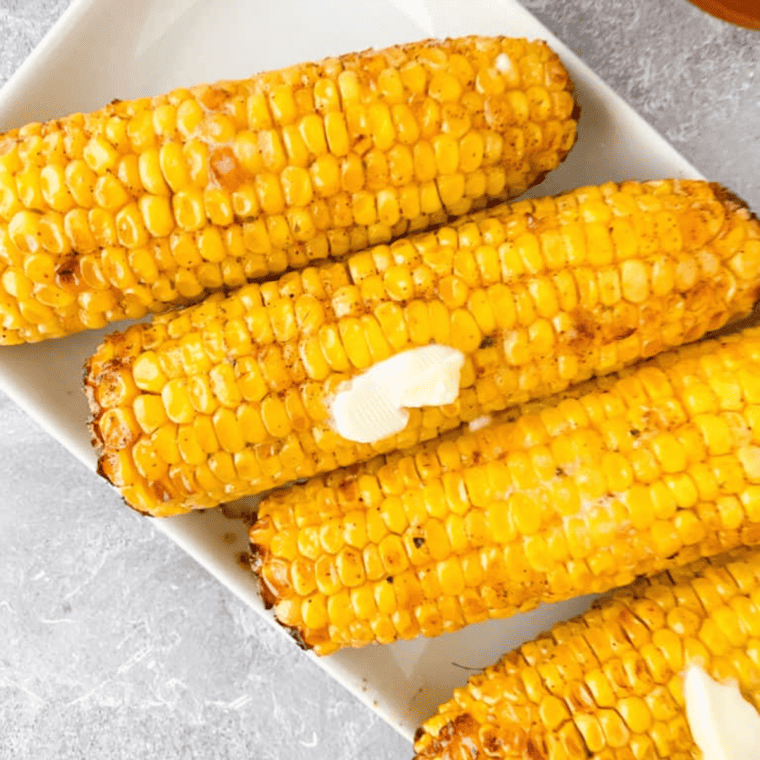 Perfectly seasoned Air Fryer Cajun Corn with a crispy, charred finish.