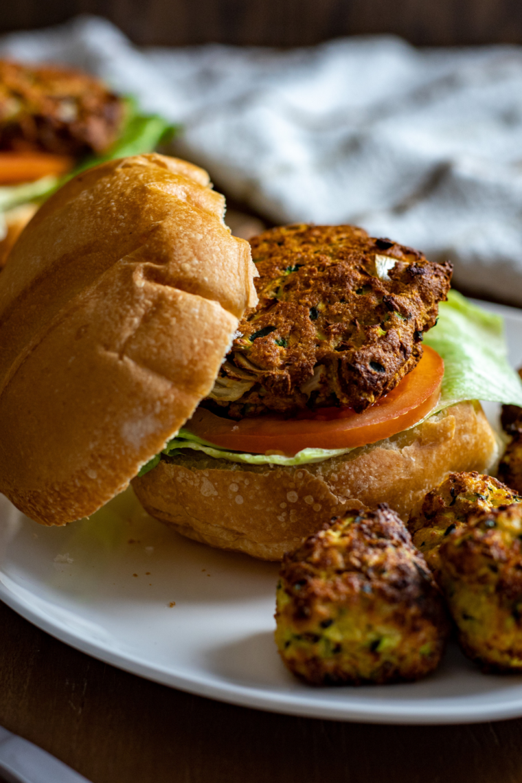 homemade zucchini burgers in air fryer basket crispy veggie patties ready to serve