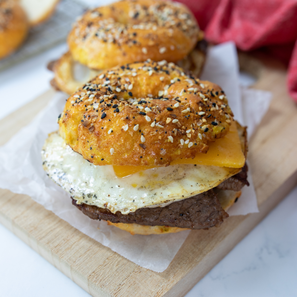 Toasting bagels on a Blackstone griddle for crispy perfection.