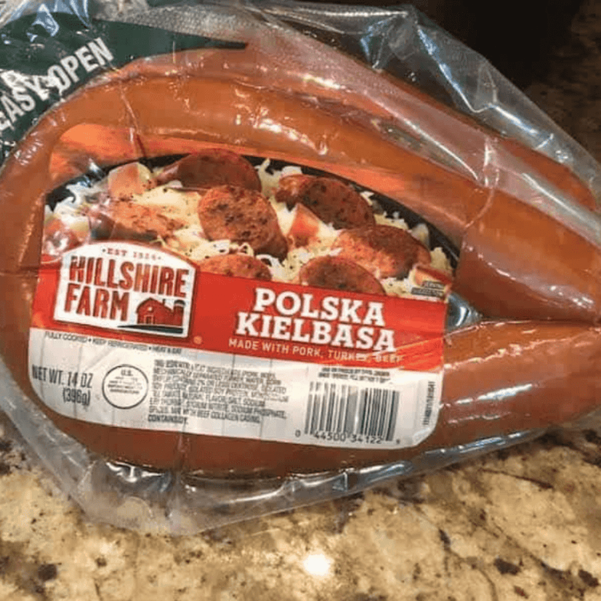 Ingredients for Blackstone griddle kielbasa including kielbasa, bell peppers, onion, oil, and seasonings