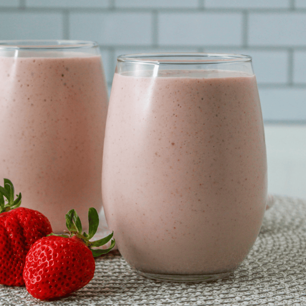 Peanut Butter and Jelly Smoothie made in the Ninja Creami with peanut butter, jelly, protein powder, and milk, blended into a creamy drink.