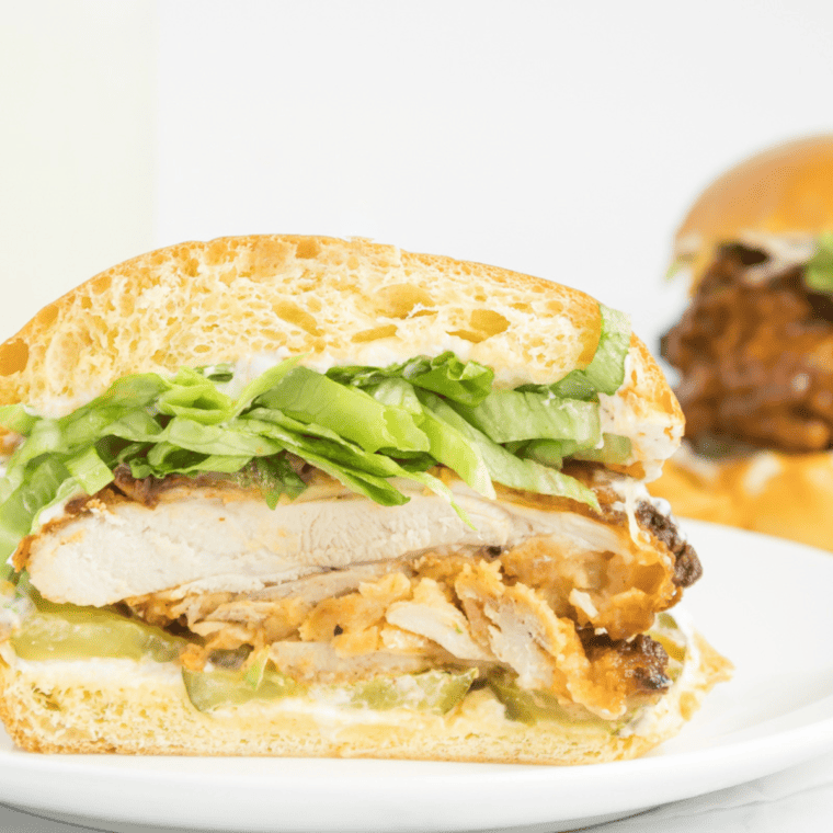 Air Fryer Hot Honey Chicken Sandwich with crispy chicken, hot honey sauce, pickles, lettuce, and a soft bun.