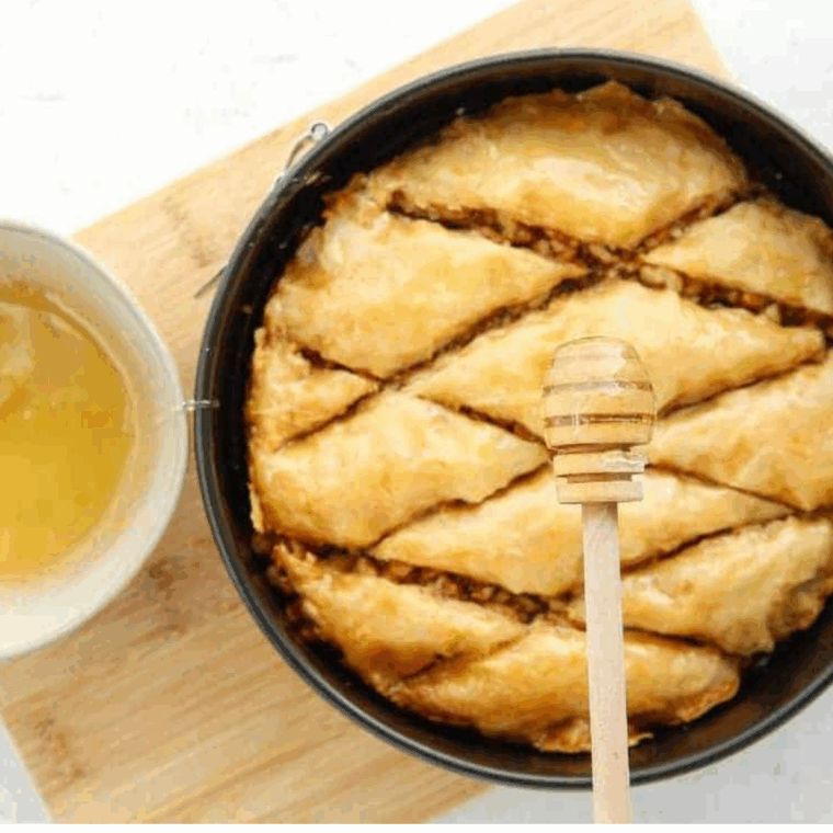 Air Fryer Baklava with golden, flaky phyllo layers and honey syrup drizzled.
