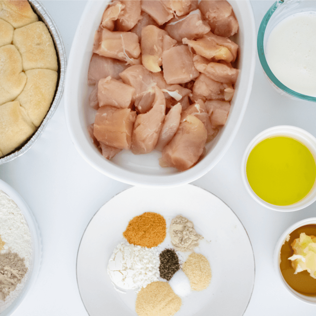 Ingredients for air fryer copycat Chick-fil-A chicken minis measured in bowls on a white table