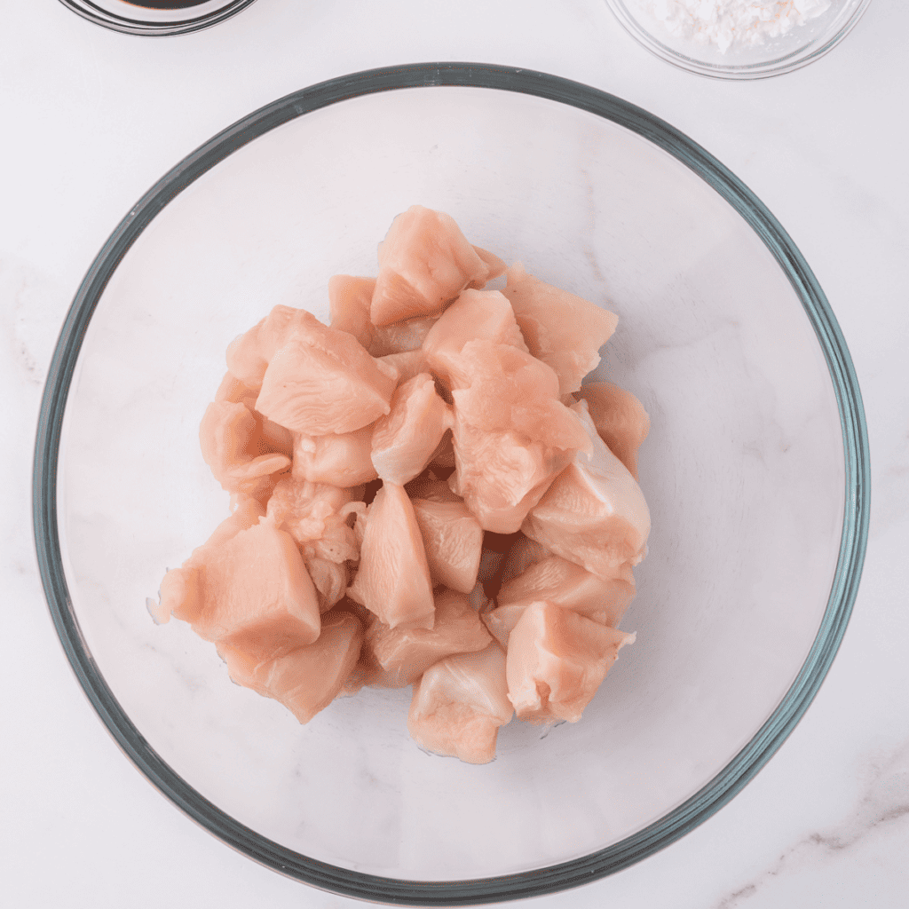 Marinating chicken breasts in a flavorful spice blend for Air Fryer Copycat Qdoba Chicken.