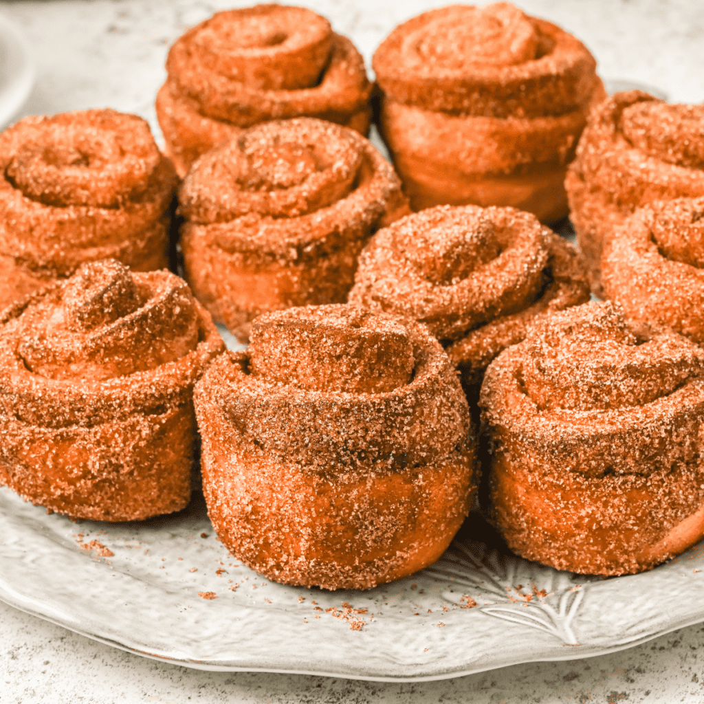 Air Fryer Cruffins topped with a dusting of powdered sugar"