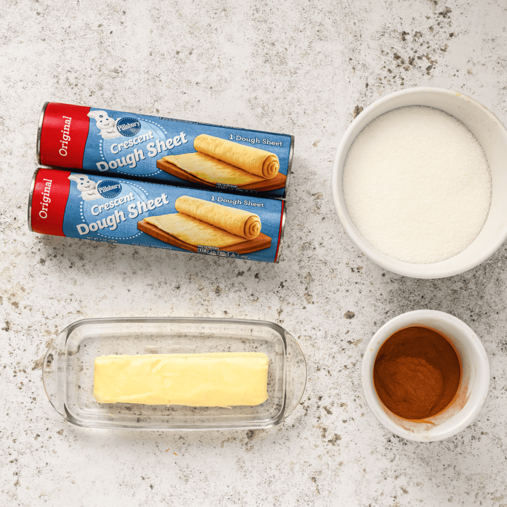 Ingredients needed for Air Fryer Cruffins on marble table.