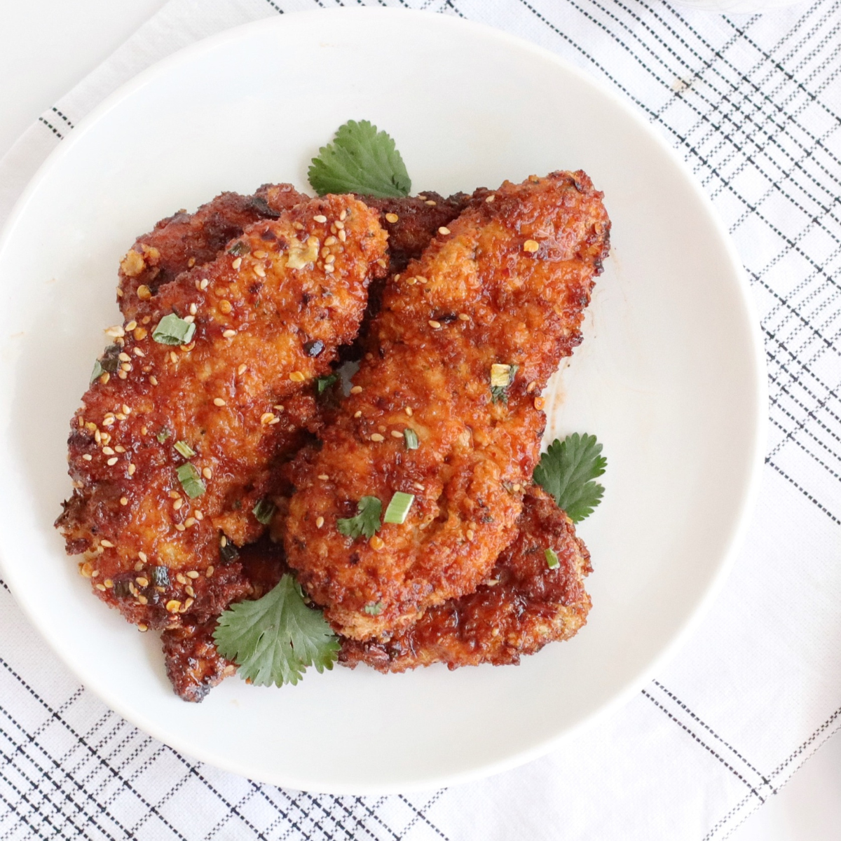 Beautifully arranged plate with golden Air Fryer Honey Garlic Chicken Tenders.