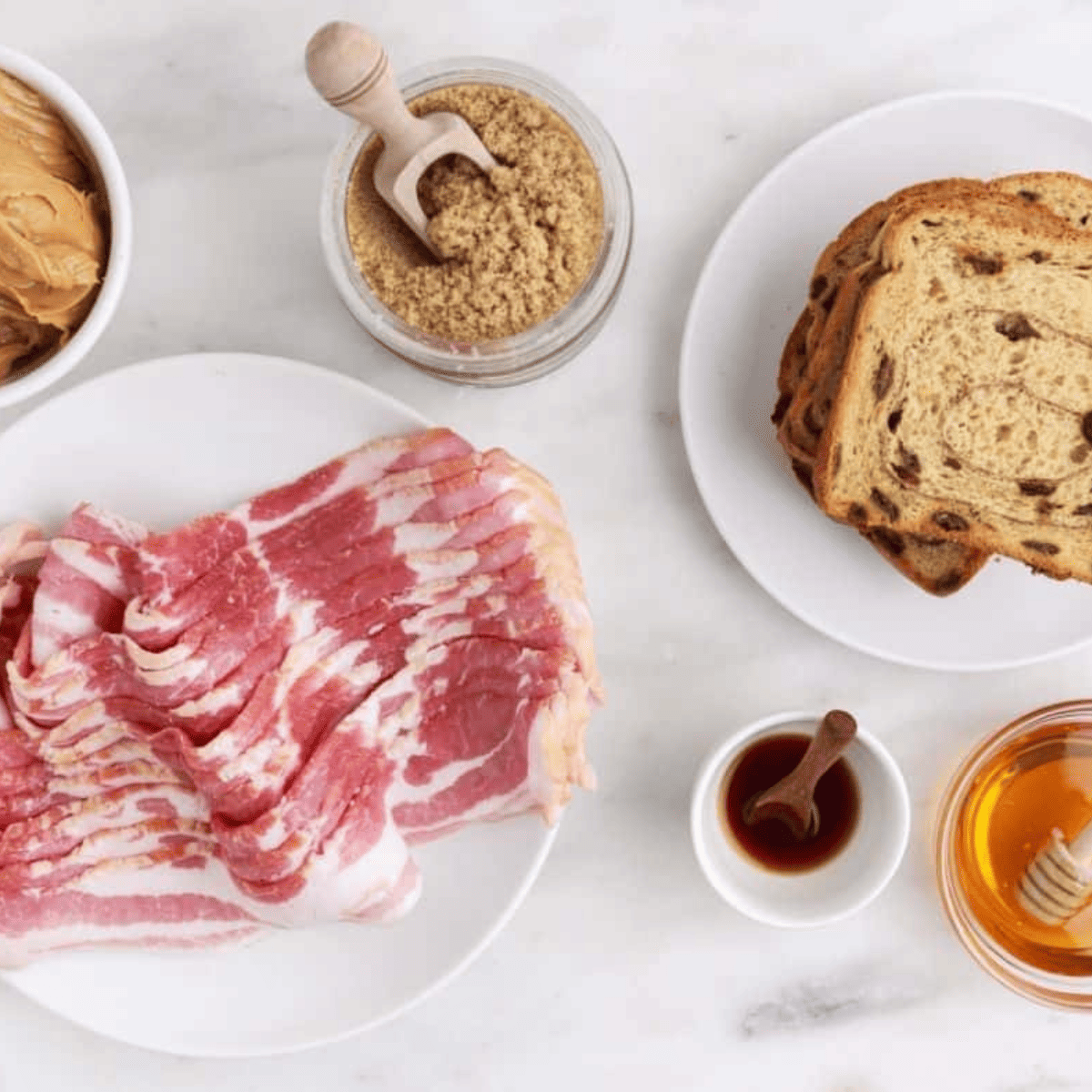 Ingredients needed for Air Fryer Peanut Butter and Bacon Sandwich on kitchen table.