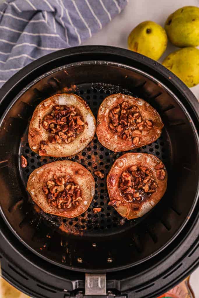 overhead: air fryer pear recipe cooking in air fryer basket