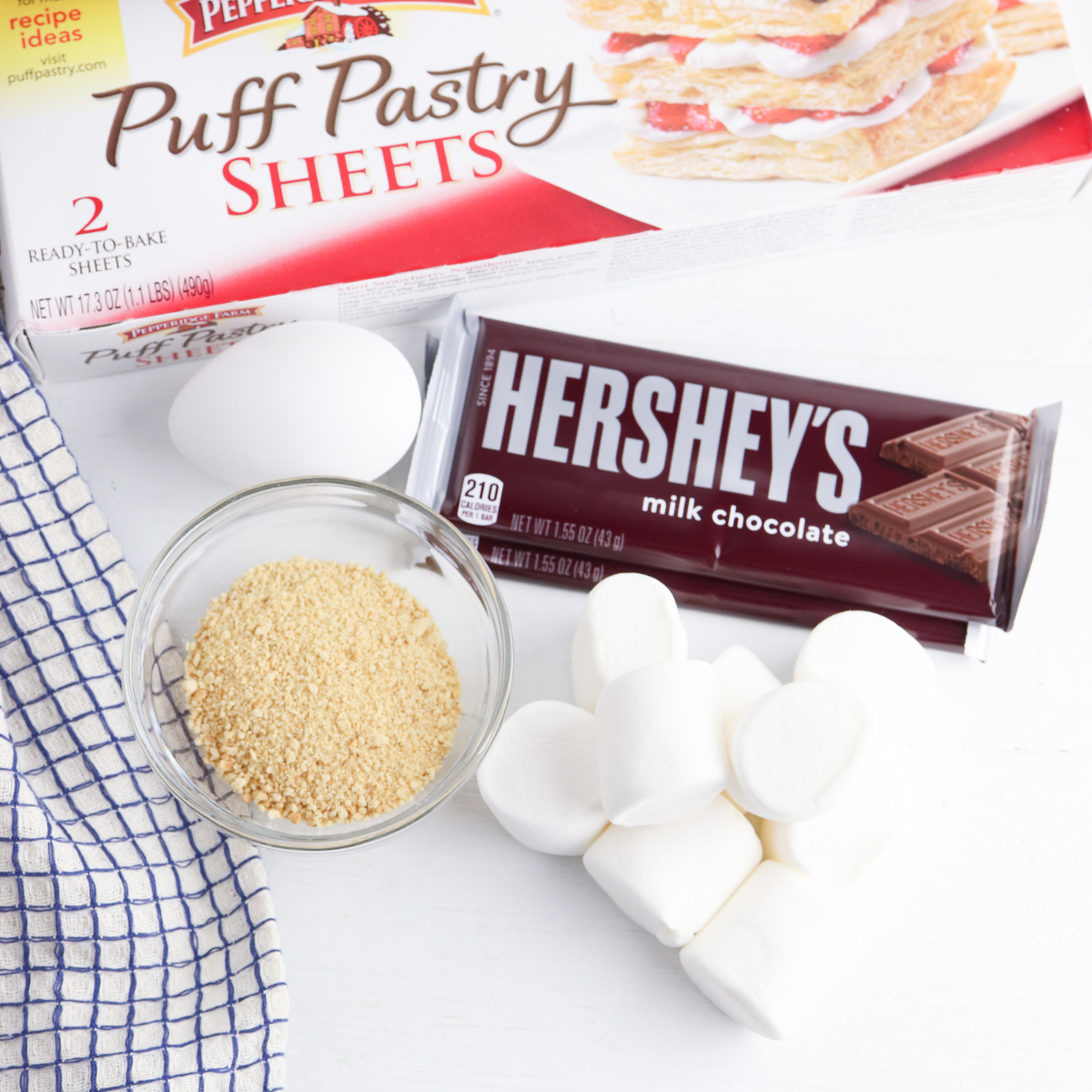 Ingredients Needed For Air Fryer Puff Pastry S'mores Bites on kitchen table.