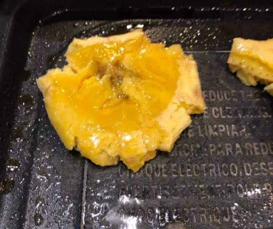 closeup: frying air fryer tostones for a second time in air fryer basket