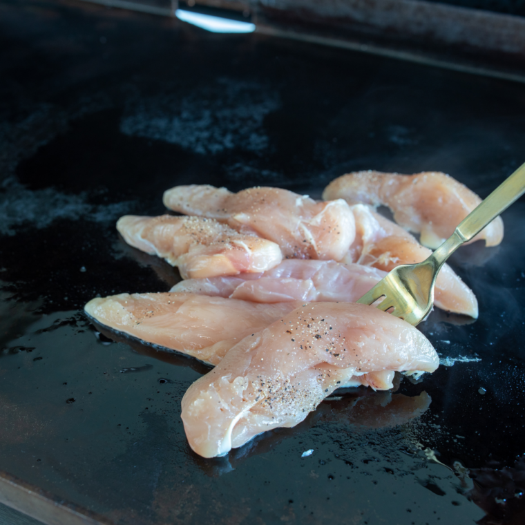Blackstone griddle preheated to 375°F with a thin shimmering coat of oil on the flat-top surface
