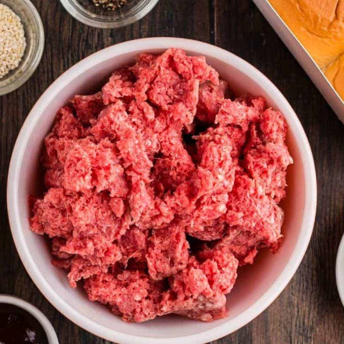 Cooking the ground beef in the air fryer safe-pan.