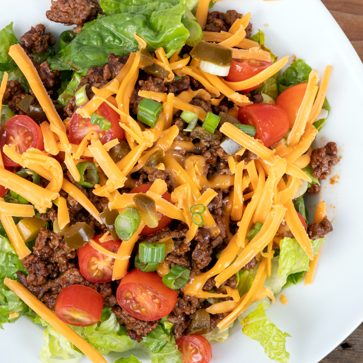 Copycat Wendy’s Taco Salad with seasoned ground beef and fresh vegetables.