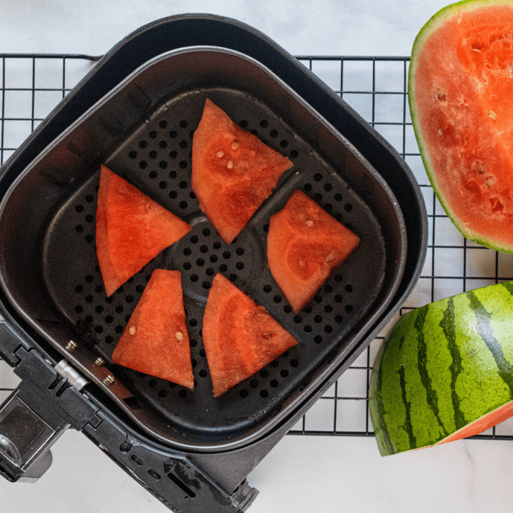 Watermelon slices sprinkled with lemon juice and salt before dehydrating