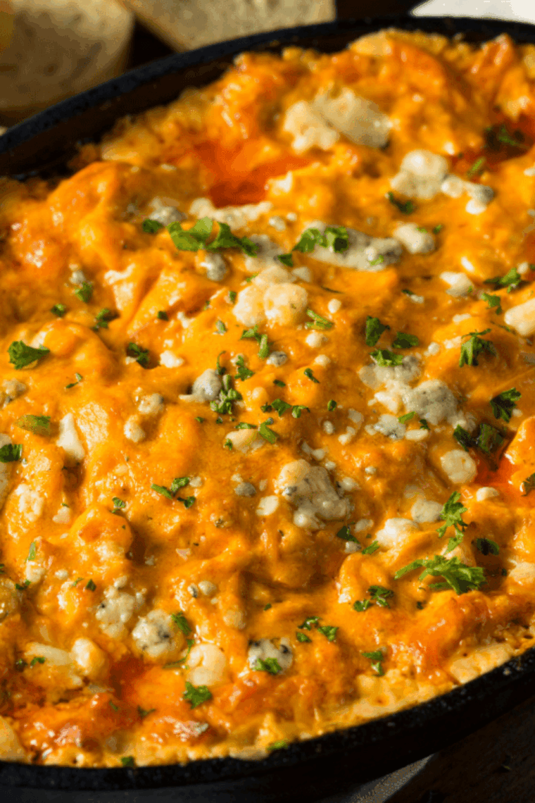 Easy Instant Pot Buffalo Chicken Dip in a bowl with tortilla chips for dipping
