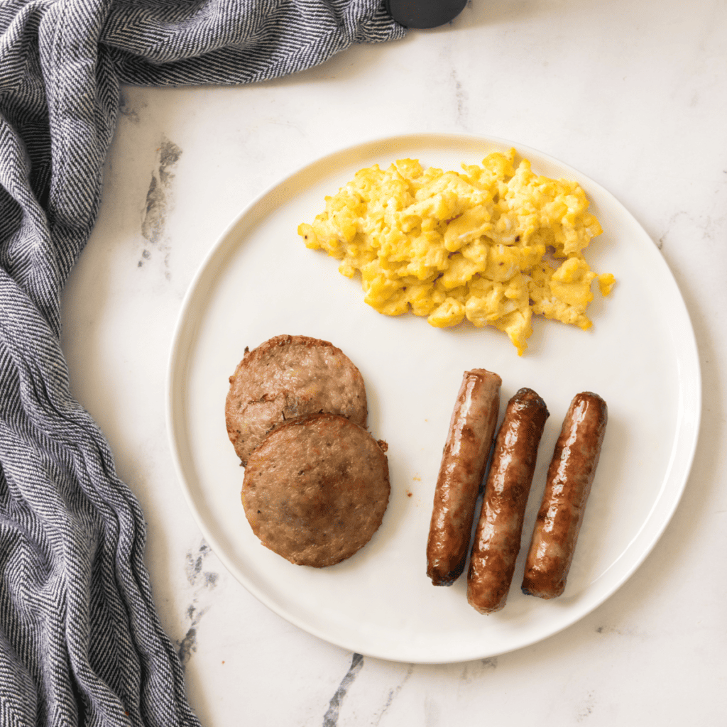 Air fryer cooked Jimmy Dean sausage patties, golden and crispy on a plate."
