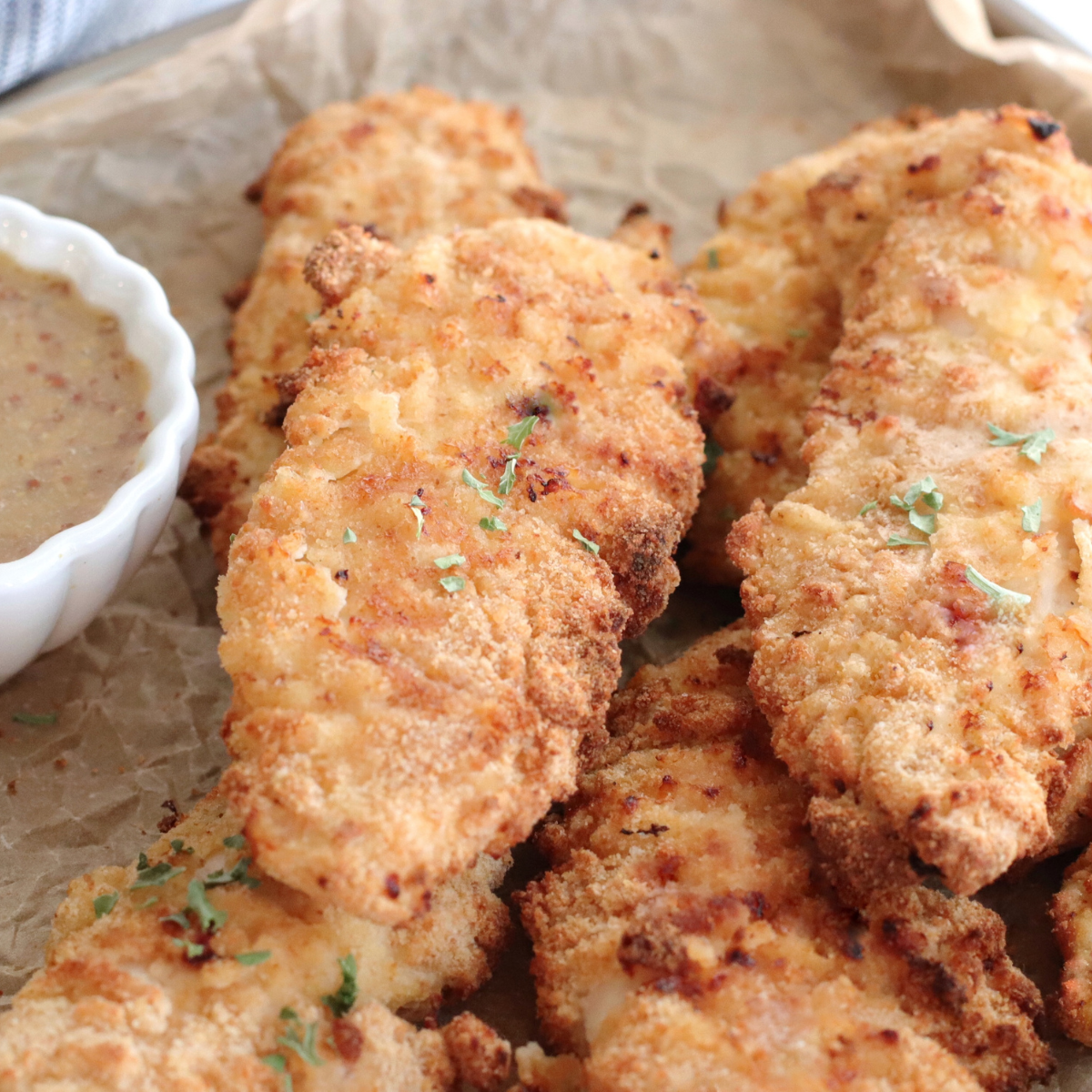 To make the most delicious and perfectly cooked chicken tenders on the Ninja Foodi Grill, here are some pro tips:
Use panko breadcrumbs: For an extra crispy coating, consider using panko breadcrumbs instead of regular breadcrumbs. Panko breadcrumbs have a lighter and crispier texture, resulting in a more satisfying crunch.
Season the breadcrumbs: Enhance the flavor of your chicken tenders by adding additional seasonings to the breadcrumb mixture. Try mixing in garlic powder, onion powder, paprika, or your favorite herbs and spices to give the tenders a tasty kick.
Preheat the grill properly: Ensure that the Ninja Foodi Grill is fully preheated before placing the chicken tenders on the grates. This helps to sear the outside quickly, sealing in the moisture and creating a nice crust.
Oil the grill grates: Prevent the chicken tenders from sticking by lightly oiling the grill grates before placing the chicken on them. You can use a brush or a paper towel to apply a thin layer of oil.
Use an instant-read thermometer: To ensure the chicken tenders are cooked to perfection, use an instant-read thermometer to check the internal temperature. The chicken should reach 165°F (74°C) for safe consumption. Avoid overcooking to maintain juiciness.
Don't overcrowd the grill: Give each chicken tender enough space on the grill grates to ensure even cooking. Overcrowding can lead to uneven heat distribution and result in less crispy tenders.
Flip with care: When flipping the chicken tenders, use tongs or a spatula to gently turn them over. Be cautious not to disturb the coating to maintain the crispy texture.
Experiment with different marinades: Before coating the chicken tenders with breadcrumbs, consider marinating them in your favorite marinade for added flavor. Teriyaki, barbecue, or honey mustard marinades can infuse the chicken with a delicious taste.
Let them rest: After grilling, allow the chicken tenders to rest for a few minutes before serving. This helps the juices redistribute, resulting in more flavorful and moist chicken.
Serve with dipping sauces: Elevate your chicken tenders by serving them with an array of dipping sauces. From classic ketchup and mustard to creamy ranch or tangy buffalo sauce, the options are endless.
By following these pro tips, you'll be able to create incredibly delicious and perfectly cooked chicken tenders on your Ninja Foodi Grill. Enjoy the crispy exterior, juicy interior, and burst of flavors with every bite!