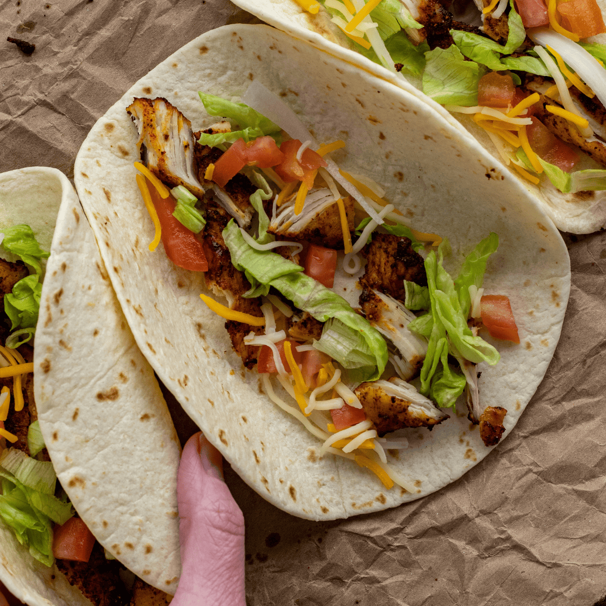 Air fryer chicken street tacos with customizable toppings for different flavor variations