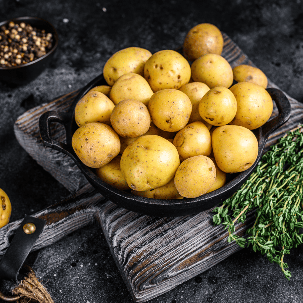 Ingredients For the Air Fryer Parmesan Potatoes Recipe on wooden table.