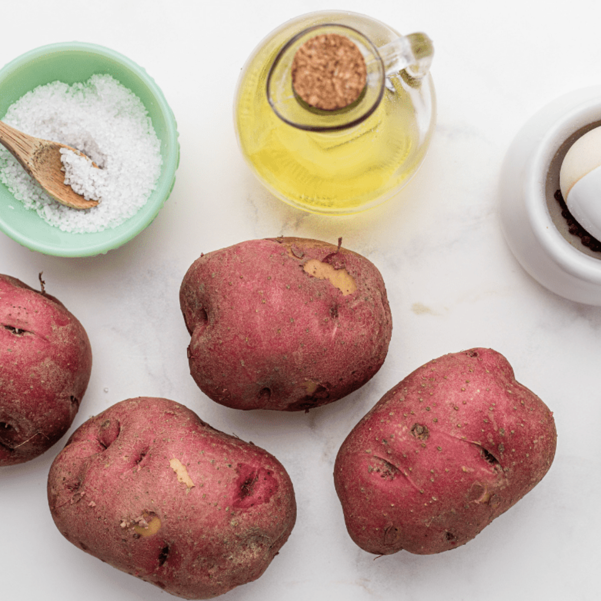 Ingredients needed for air fryer potato salad on table.