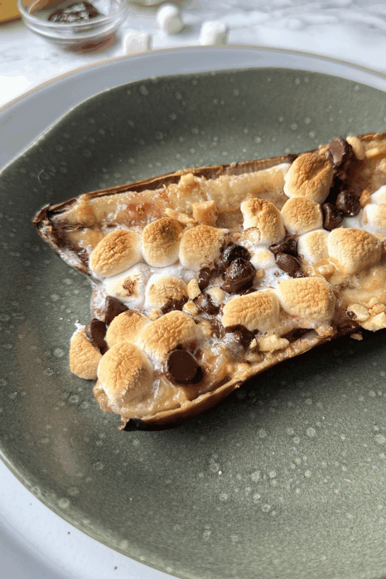 Air fryer banana split with ice cream, chocolate sauce, and bananas