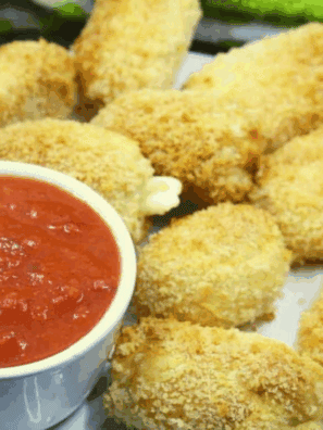 “Golden, crispy Air Fryer Brie Bites with melted cheese inside, served on a plate.”