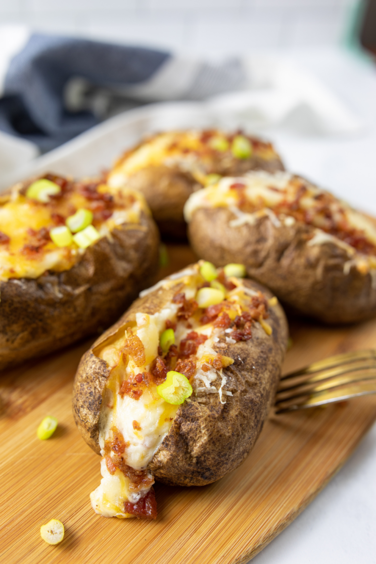 Golden baked potato cooking on Blackstone griddle